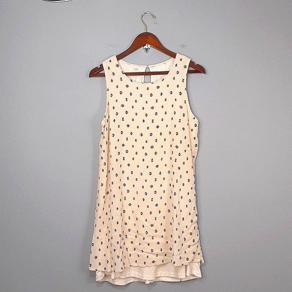 Sleeveless Cream Dress with Black Pattern